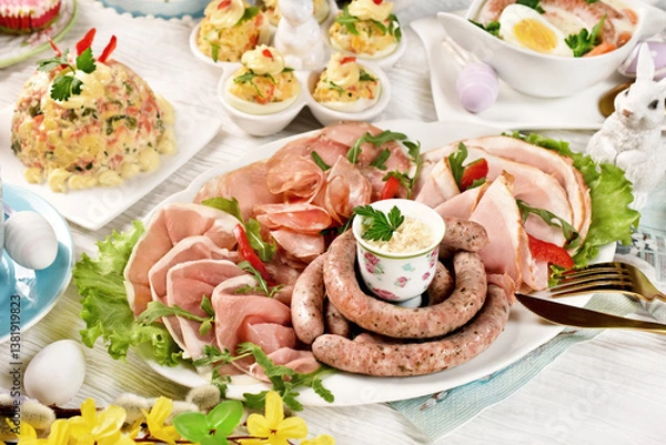 Obraz Easter breakfast with a plate of cold cuts, deviled eggs and vegetable salad