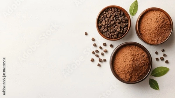Fototapeta Assorted cocoa products in rustic bowls on a white background