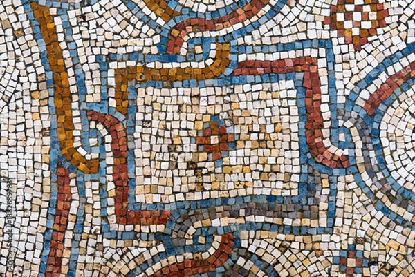 Fototapeta Background with a fragment of an ancient decorative mosaic on the floor of ruined church