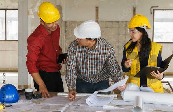 Fototapeta Team of business people in group, architect and engeneer on construciton site check documents and business workflow on new building