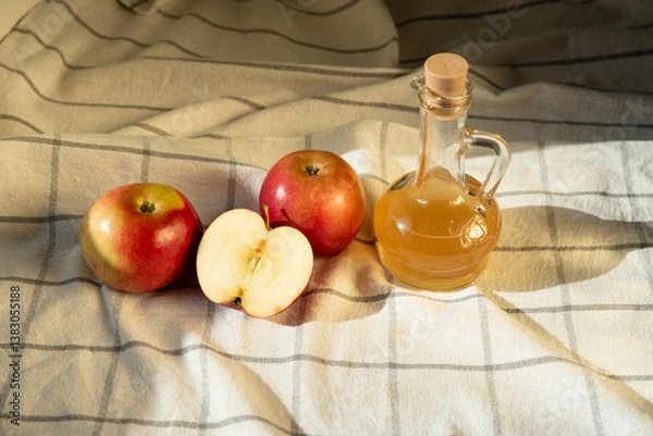 Fototapeta Apple cider vinegar in a jar and apples on the table