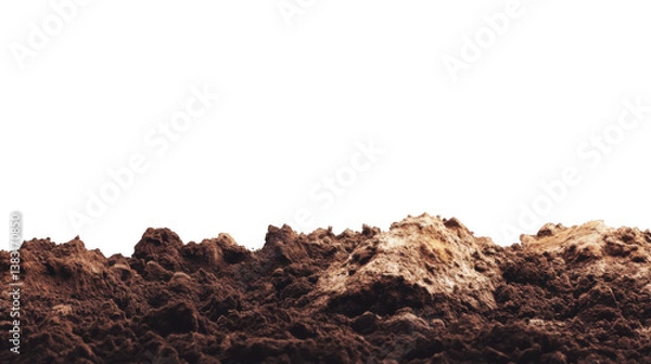 Fototapeta A close up view of brown dirt and soil against a black background in a studio setting outdoors