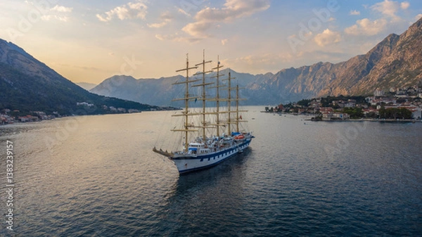 Obraz Sunset landscape of the Royal Clipper sailing ship in the Bay of Kotor in the sea between the mountains. Used cruise ship travel and holidays
