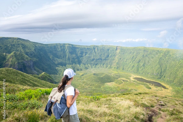 Fototapeta Hiker admires the Sete Cidades caldera view in Sao Miguel, Azores.