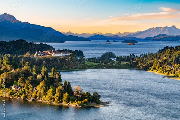 Fototapeta Beautiful scenic view of Llao Llao on Nahuel Huapi lake and Moreno lake at dusk, with the majestic Andes mountain range in the background in San Carlos de Bariloche, Argentina.