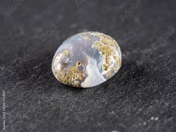 Fototapeta chalcedony, moss agate is a semi-transparent gemstone featuring dendritic inclusions resembling moss foliage.