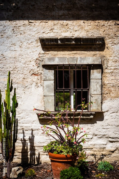 Fototapeta rustic barred window at mission in San Juan Capistrano