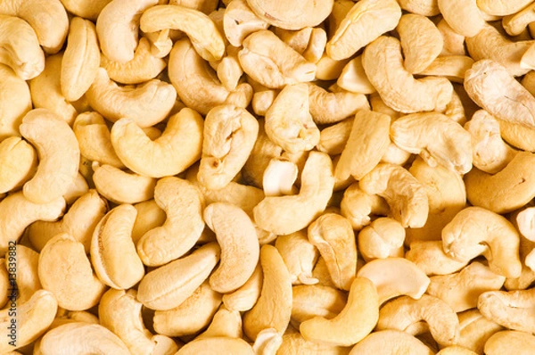 Fototapeta Cashew nuts arranged at the background