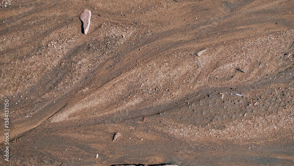 Fototapeta Close up of patterns of fine silt in runoff
