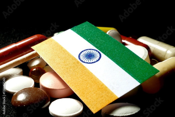 Obraz Indian flag with lot of medical pills isolated on black background
