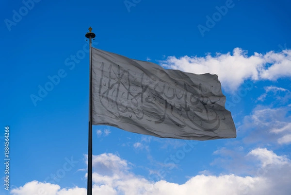 Fototapeta national flag of Afghanistan on a blue-sky background