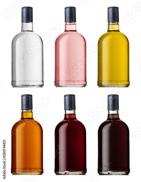 Fototapeta Set of a glass bottle with different color liquids. Isolated on a white background. Alcohol drinks: gin, vodka, brandy, rum, liqueur, whisky.