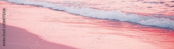Fototapeta Adventurous person riding a surfboard on a vibrant blue ocean wave under clear sky