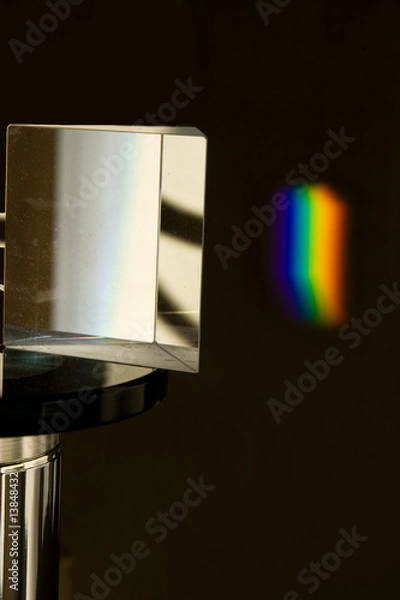 Fototapeta prism dispersing sunlight into a rainbow
