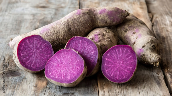 Fototapeta Purple yams are vibrant, nutritious tubers with striking purple interior, perfect for various culinary uses and healthy dishes. Their unique color adds visual appeal to meals