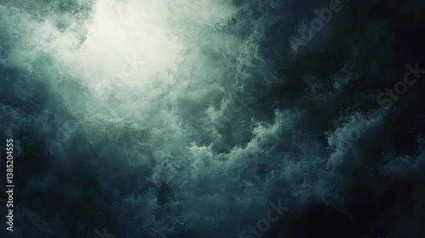 Fototapeta Dark, stormy clouds with a bright light breaking through.