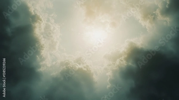 Fototapeta Sun shining through dark clouds.