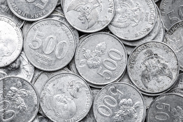Fototapeta Indonesian Rupiah Coins Close-Up. Pile of Indonesian 500 Rupiah Coins. Stack of penny coins