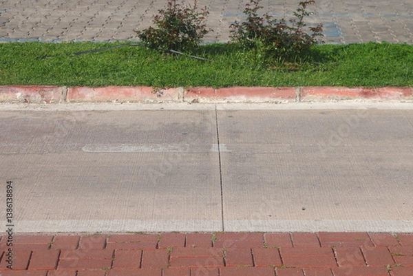 Obraz A section of an asphalt road with a curb stone and a lawn, minimalism, urbanism, 25