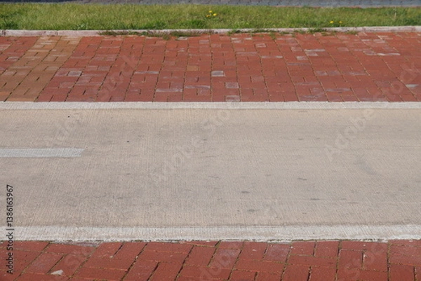 Obraz A section of an asphalt road with a curb stone and a lawn, minimalism, urbanism, 25