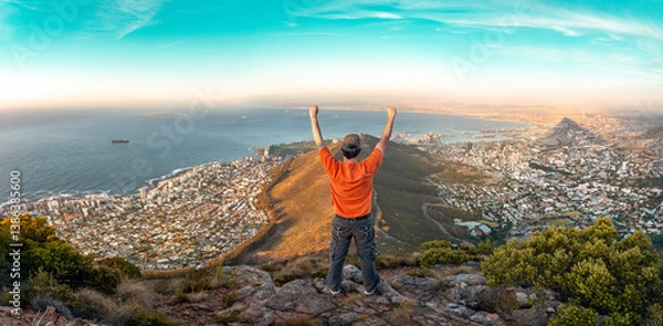 Obraz Top of the world - Victory and success. Cape Town hiker reaches summit of Lions Head, Table Mountain. South Africa is best travel and tourism destination for adventure and nature