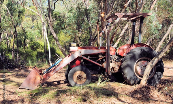 Fototapeta Vintage British working tractor with bucket attached on South Australian bush block