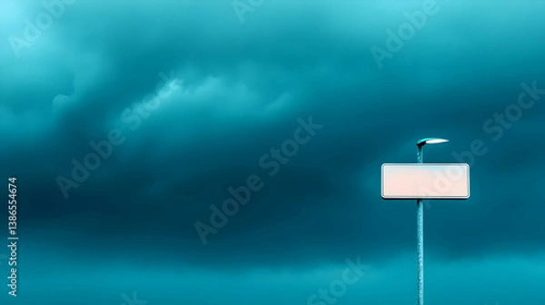 Obraz Dark Teal Sky with Storm Clouds and a Blank Sign on a Pole