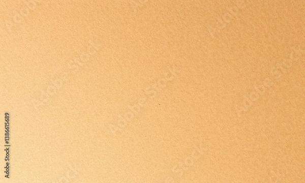 Fototapeta smooth, textured surface of kraft paper in warm, golden hue, perfect for various crafting and artistic projects. This versatile material adds natural touch to any creation
