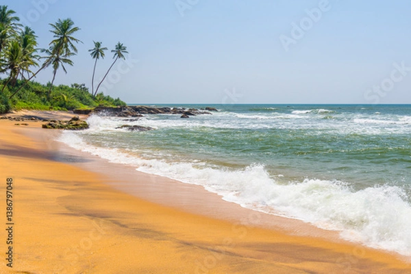 Fototapeta Waves on the beach near Galle town on Sri Lanka island