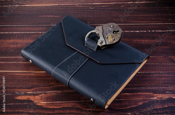 Obraz leather organizer with old padlock