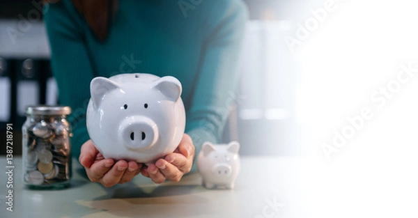 Fototapeta Save smart! Explore financial planning with coins, piggy banks, and digital tools. Perfect for savings, banking