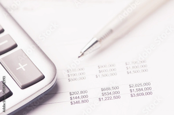 Fototapeta Financial paper charts and graphs on the table