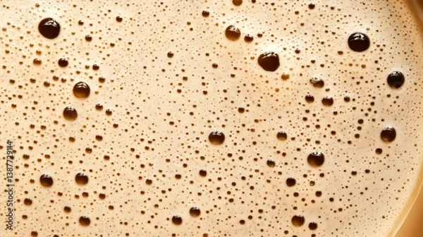 Fototapeta Extreme close-up view of creamy coffee foam texture with rich bubbles and abstract pattern on surface. Concept of caffeine, beverage detail, and morning freshness