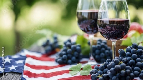 Obraz Celebratory Independence Day Gathering, two glasses of wine beside fresh grapes, set on an American flag blanket, capturing the spirit of a joyful Fourth of July picnic.
