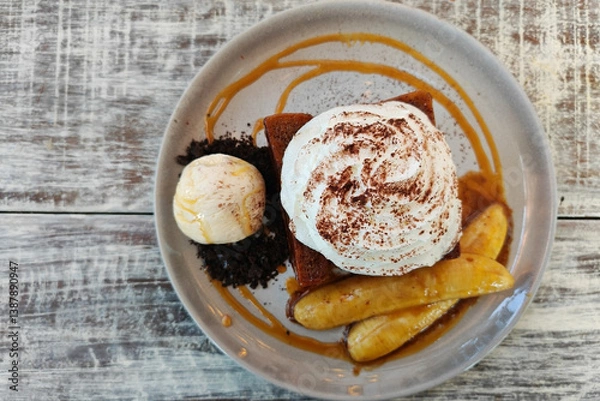 Fototapeta top view dessert of Honey toast, ice cream, banana, whipping cream