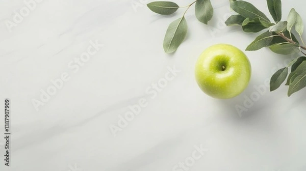 Obraz Green apple with leaves on marble background.