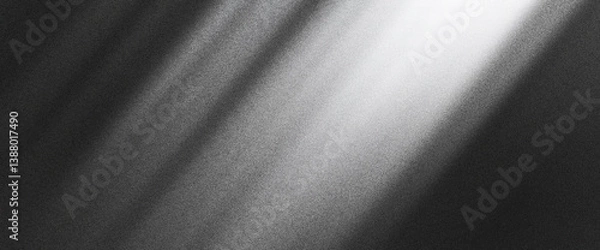 Fototapeta Subtle grainy noise texture with white light on black gradient, creating a smooth abstract gradient design