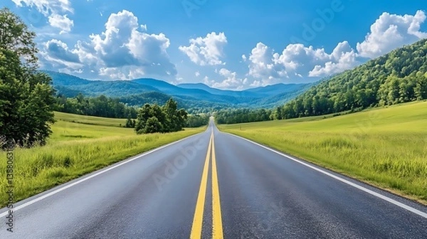 Fototapeta A scenic drive through a picturesque landscape with open fields, rolling hills, and the excitement of a road trip adventure