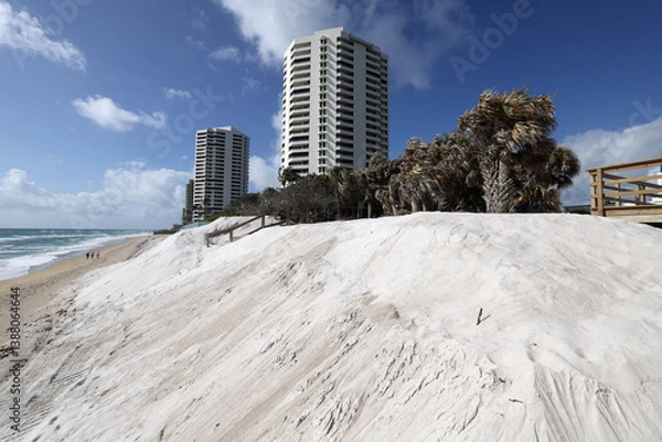 Obraz In anticipation of adding a sea wall on oceanfront property, a sand replenishment project was done to mitigate beach erosion.