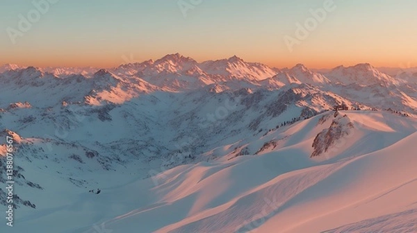 Fototapeta Sunset over snowy mountain range.