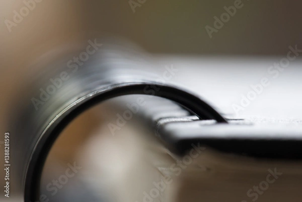 Obraz Close-up view of a spiral notebook with a curled page, capturing details of stationery and writing