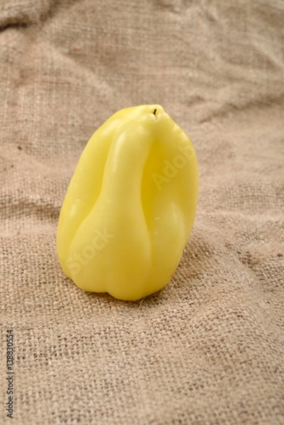 Obraz Sweet yellow pepper lying on jute canvas background. Concept of healthy food, bio from countryside