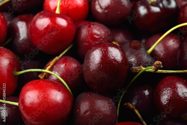 Obraz Pile of red cherries with drops of water on them, just removed from the refrigerator. Fresh fruit background texture.