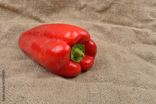 Obraz Red pepper lying on on sackcloth background. Concept of healthy food, bio from countryside