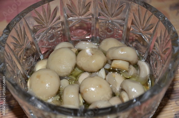 Obraz Marinated small champignon mushrooms in a crystal vase.