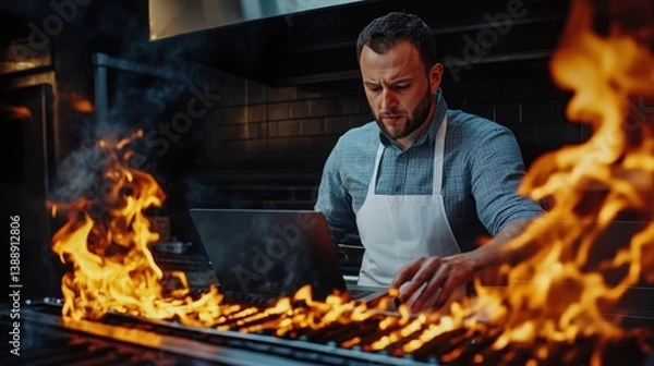 Fototapeta Chef Using Laptop Near Flames - Modern Restaurant Management Concept