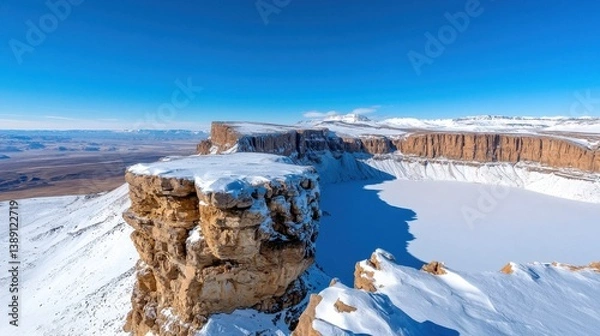 Obraz Breathtaking frozen landscape of snow capped mountains and icy cliff formations in a remote rugged wilderness setting  This dramatic serene winter scene showcases the majestic