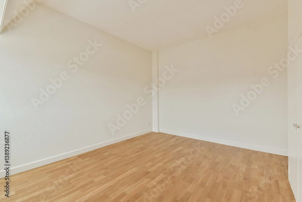 Fototapeta A spacious, minimalist room featuring bare walls and smooth wooden flooring, perfect for various design ideas and interior setups.