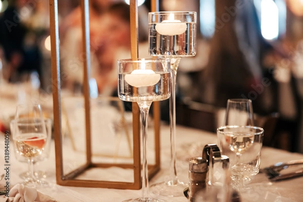 Fototapeta A graceful candle stand, glowing softly, casting warm light and quiet charm. Each flame adds a touch of magic to the atmosphere of love and celebration