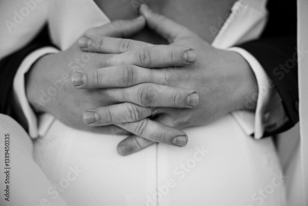 Fototapeta Wrapped in each other’s arms, they hold more than just hands — they hold a future, a promise, and a love that feels like home. A quiet moment full of meaning and forever